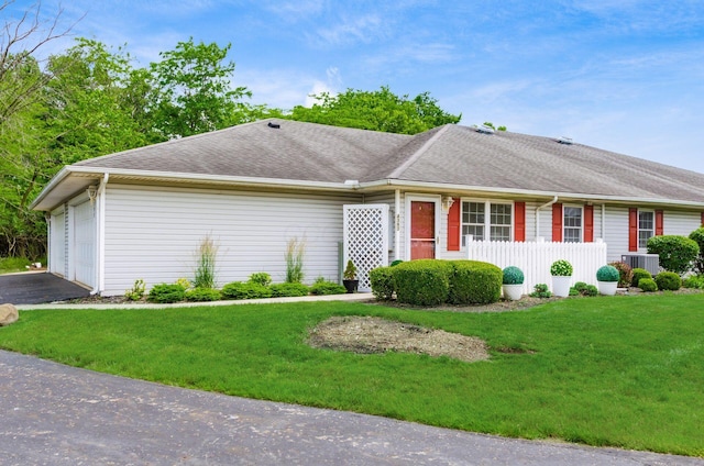 4393 Hammerton Dr Unit 14B, Columbus, OH 43228 - ranch-style home with a front yard, driveway, a garage, and roof with shingles