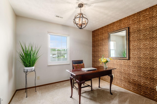 4393 Hammerton Dr Unit 14B, Columbus, OH 43228 - home office with a chandelier, light carpet, and a textured ceiling