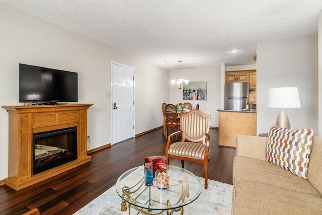 4393 Hammerton Dr Unit 14B, Columbus, OH 43228 - living area featuring a chandelier, dark wood-style floors, a fireplace, and recessed lighting