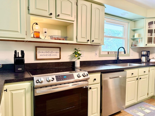 1855 Itawamba Trl, London, OH 43140 - kitchen featuring stainless steel appliances, a sink, open shelves, and dark countertops