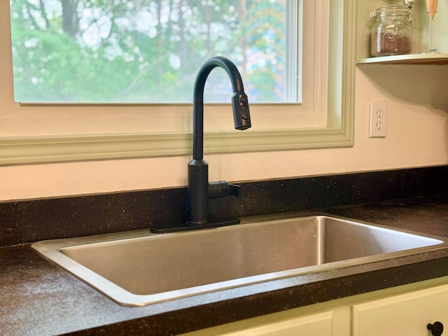 1855 Itawamba Trl, London, OH 43140 - kitchen view of a sink, dark countertops, and white cabinets