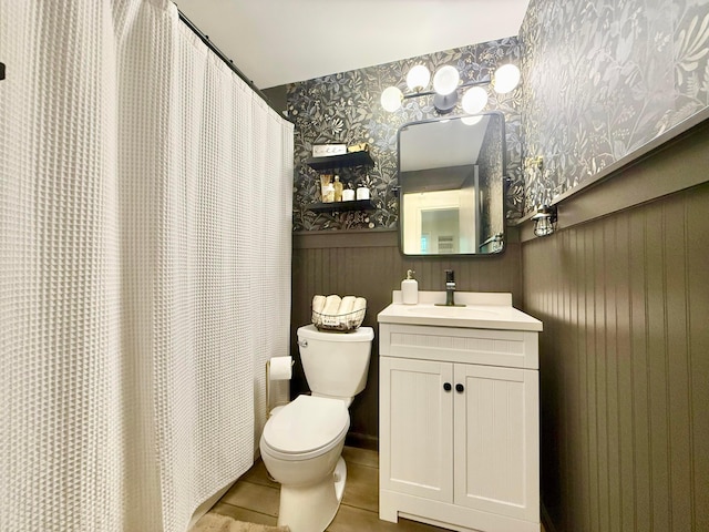 1855 Itawamba Trl, London, OH 43140 - full bathroom featuring toilet, wallpapered walls, vanity, tile patterned flooring, and curtained shower