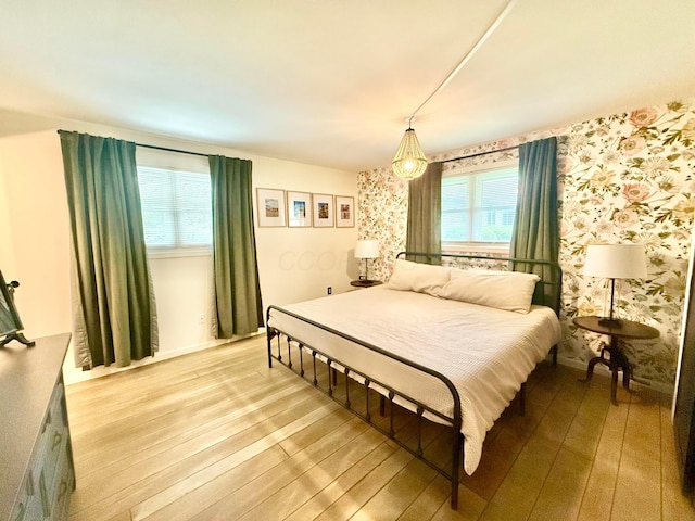1855 Itawamba Trl, London, OH 43140 - bedroom with wallpapered walls, wood-type flooring, and baseboards