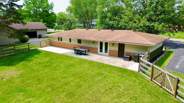1855 Itawamba Trl, London, OH 43140 - rear view of house with a patio and roof with shingles