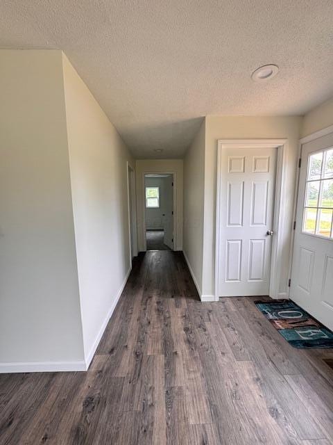 1729 E 17th Ave, Columbus, OH 43219 - entrance foyer with a textured ceiling, dark wood finished floors, and baseboards