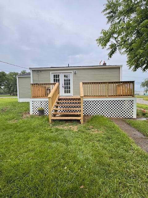 1729 E 17th Ave, Columbus, OH 43219 - rear view of house with a deck and a lawn