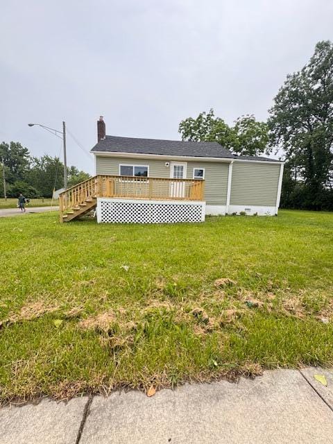 1729 E 17th Ave, Columbus, OH 43219 - view of front of property with a deck, a front yard, and a chimney