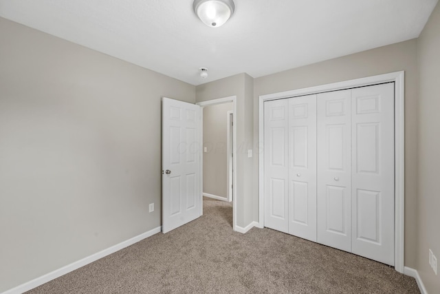 845 Bennett St, Marion, OH 43302 - unfurnished bedroom featuring carpet floors, baseboards, and a closet