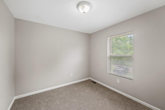 845 Bennett St, Marion, OH 43302 - spare room featuring carpet and baseboards