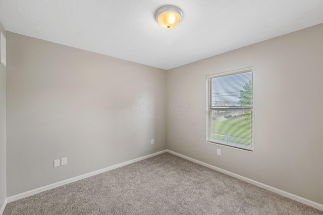 845 Bennett St, Marion, OH 43302 - empty room with carpet flooring and baseboards