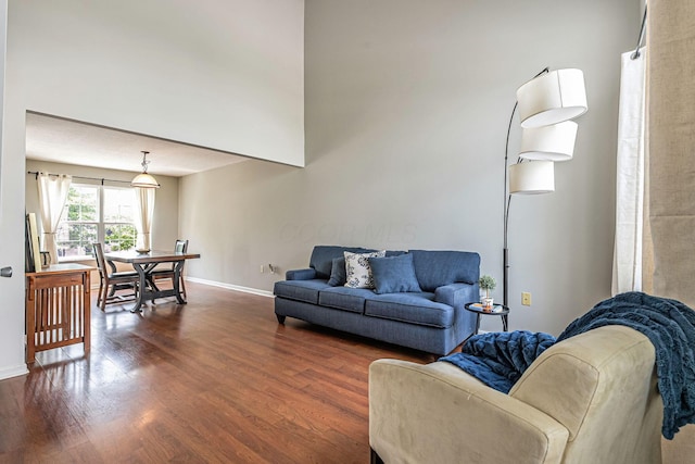 8281 Deering Oaks Dr, Blacklick, OH 43004 - living room with dark wood finished floors, baseboards, and a high ceiling