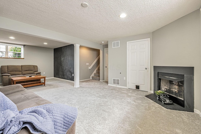8281 Deering Oaks Dr, Blacklick, OH 43004 - living room with stairs, light colored carpet, a fireplace with flush hearth, recessed lighting, and a textured ceiling