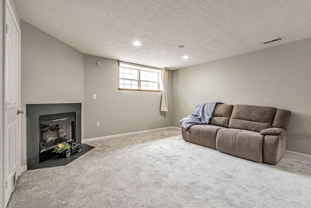 8281 Deering Oaks Dr, Blacklick, OH 43004 - carpeted living area with a fireplace with flush hearth, a textured ceiling, baseboards, and recessed lighting