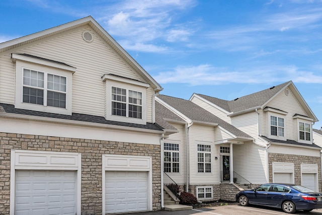 8281 Deering Oaks Dr, Blacklick, OH 43004 - multi unit property with an attached garage, stone siding, and a shingled roof