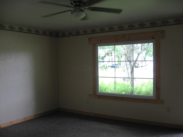 252 Randolph St, Wilmington, OH 45177 - carpeted spare room featuring a ceiling fan and baseboards