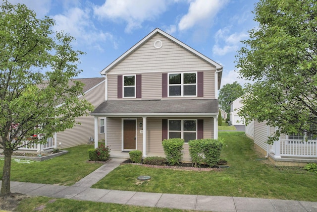 2563 Bristlecone Ln, Grove City, OH 43123 - traditional home featuring a porch, a front lawn, and roof with shingles