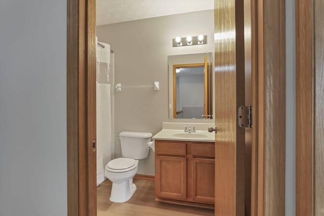 2563 Bristlecone Ln, Grove City, OH 43123 - full bathroom featuring vanity, toilet, and wood finished floors