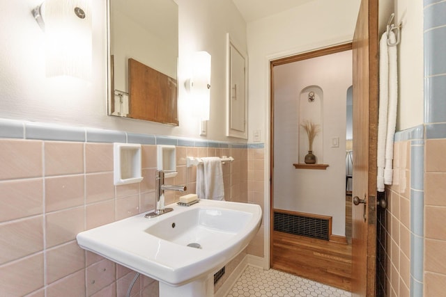 525 E Como Ave, Columbus, OH 43202 - bathroom featuring tile patterned flooring, tile walls, and a wainscoted wall