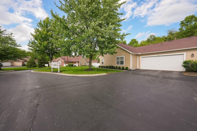 4654 Collingville Way, Columbus, OH 43230 - view of front of property with driveway, an attached garage, and a front yard