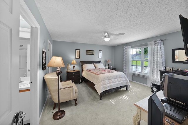4654 Collingville Way, Columbus, OH 43230 - bedroom featuring light carpet, a textured ceiling, connected bathroom, a ceiling fan, and baseboards