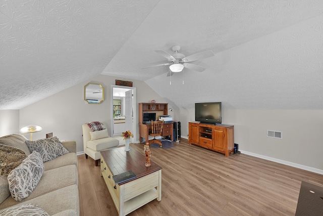 4654 Collingville Way, Columbus, OH 43230 - living room with light wood-style floors, a textured ceiling, baseboards, lofted ceiling, and a ceiling fan
