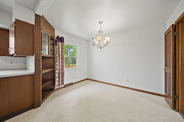 5754 Loganwood Rd, Columbus, OH 43229 - unfurnished dining area featuring a chandelier, baseboards, and light flooring
