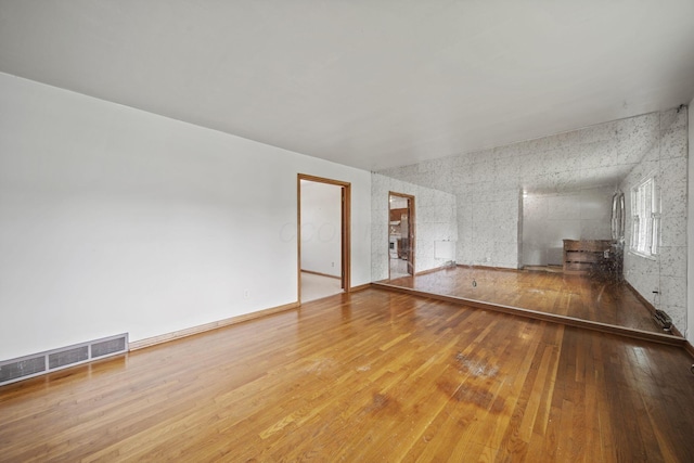 5754 Loganwood Rd, Columbus, OH 43229 - unfurnished living room featuring wood-type flooring