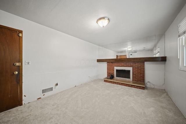 5754 Loganwood Rd, Columbus, OH 43229 - unfurnished living room featuring carpet floors and a fireplace