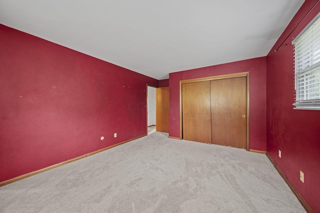 5754 Loganwood Rd, Columbus, OH 43229 - unfurnished bedroom featuring a closet, carpet floors, and baseboards
