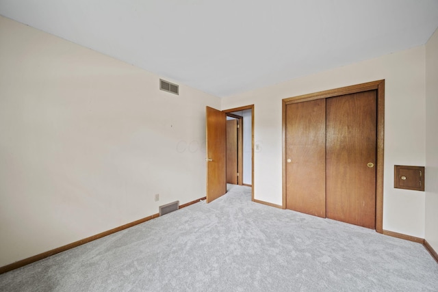 5754 Loganwood Rd, Columbus, OH 43229 - unfurnished bedroom with baseboards, carpet, and a closet