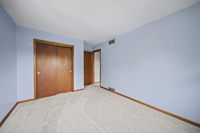 5754 Loganwood Rd, Columbus, OH 43229 - unfurnished bedroom featuring baseboards, a closet, and carpet floors