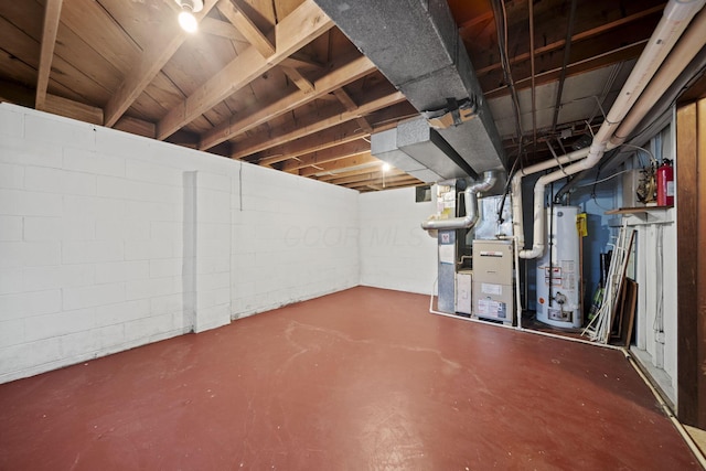 5754 Loganwood Rd, Columbus, OH 43229 - unfinished below grade area with gas water heater, concrete block wall, and heating unit