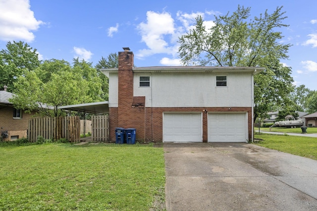 5754 Loganwood Rd, Columbus, OH 43229 - view of side of property featuring a garage, concrete driveway, a chimney, brick siding, and stucco siding