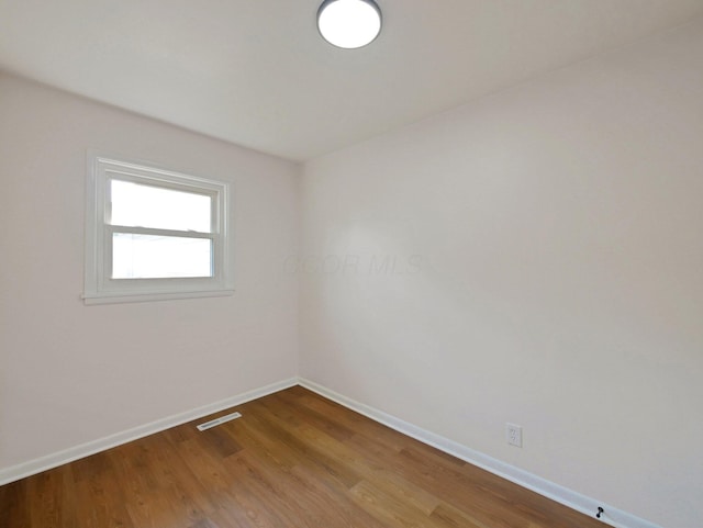 68 Mary St, West Jefferson, OH 43162 - empty room featuring baseboards and wood finished floors