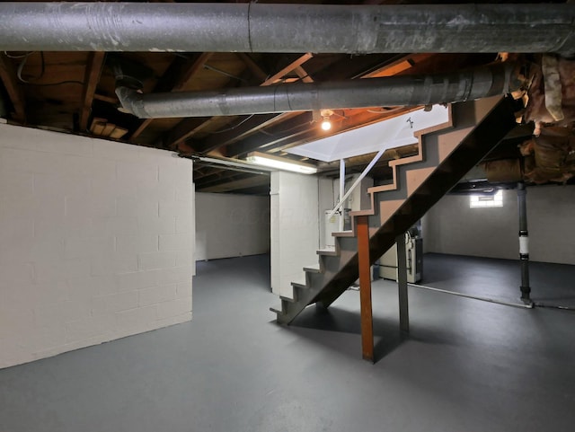 68 Mary St, West Jefferson, OH 43162 - unfinished basement with stairway and concrete block wall
