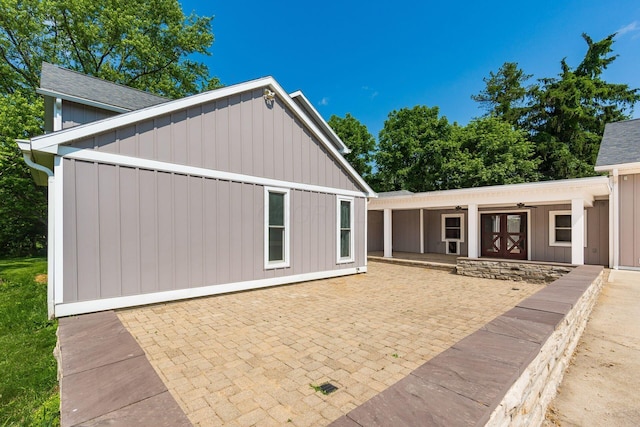 6900 Waterloo Rd NW, Canal Winchester, OH 43110 - rear view of property featuring a patio, a ceiling fan, and board and batten siding