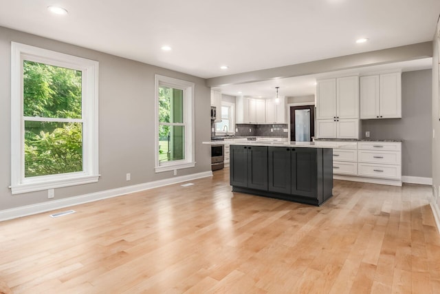 6900 Waterloo Rd NW, Canal Winchester, OH 43110 - kitchen with white cabinets, healthy amount of natural light, light wood-style flooring, and recessed lighting