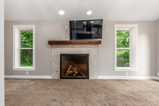 6900 Waterloo Rd NW, Canal Winchester, OH 43110 - unfurnished living room featuring carpet, healthy amount of natural light, and a fireplace