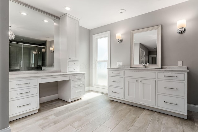 6900 Waterloo Rd NW, Canal Winchester, OH 43110 - bathroom featuring vanity, wood finished floors, a stall shower, and recessed lighting