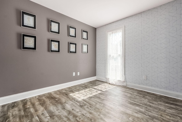 6900 Waterloo Rd NW, Canal Winchester, OH 43110 - empty room featuring wood finished floors and wallpapered walls