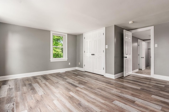 6900 Waterloo Rd NW, Canal Winchester, OH 43110 - unfurnished bedroom with wood finished floors and a closet