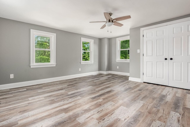 6900 Waterloo Rd NW, Canal Winchester, OH 43110 - unfurnished bedroom featuring light wood finished floors, a closet, and ceiling fan