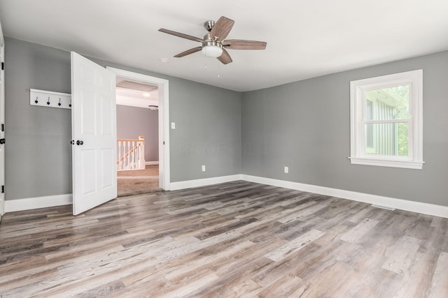 6900 Waterloo Rd NW, Canal Winchester, OH 43110 - empty room with wood finished floors and a ceiling fan