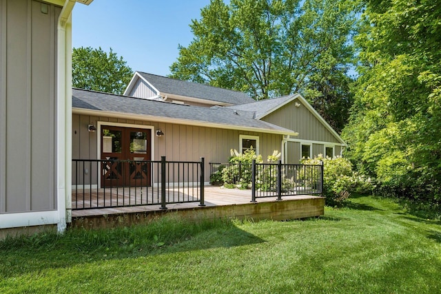 6900 Waterloo Rd NW, Canal Winchester, OH 43110 - rear view of house with a shingled roof, a deck, a yard, french doors, and board and batten siding