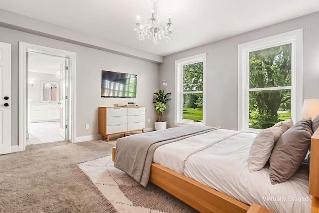 6900 Waterloo Rd NW, Canal Winchester, OH 43110 - bedroom featuring a chandelier, light colored carpet, and ensuite bathroom