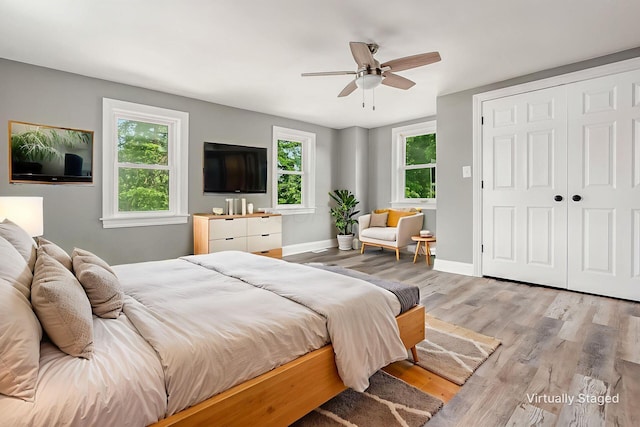 6900 Waterloo Rd NW, Canal Winchester, OH 43110 - bedroom featuring wood finished floors, a ceiling fan, and a closet