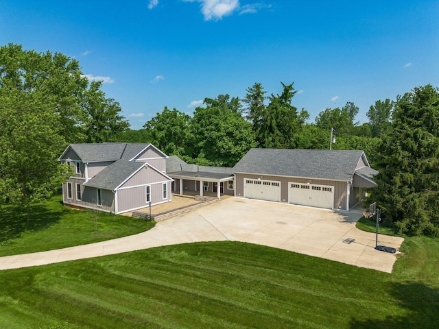 6900 Waterloo Rd NW, Canal Winchester, OH 43110 - view of front facade featuring concrete driveway, a front lawn, and a shingled roof