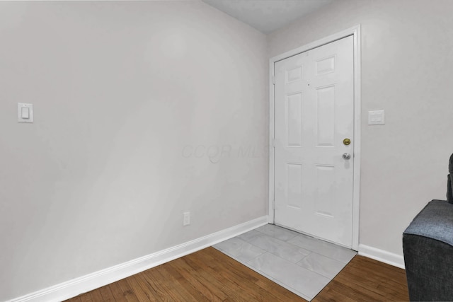 2217 Grasmere Ave, Columbus, OH 43211 - entryway with baseboards and wood finished floors