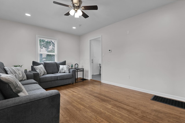 2217 Grasmere Ave, Columbus, OH 43211 - living room with wood finished floors, ceiling fan, baseboards, and recessed lighting
