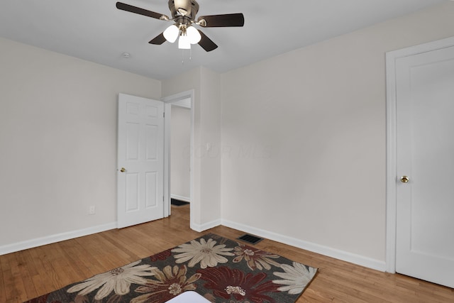 2217 Grasmere Ave, Columbus, OH 43211 - empty room featuring baseboards, wood finished floors, and a ceiling fan
